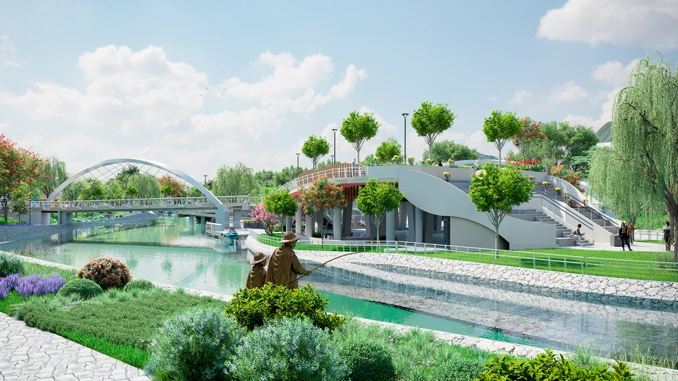 Escultura de un adulto y un niño con sombrero y poncho, pescando a orillas de un canal; al fondo, un puente peatonal de arco blanco y una plaza elevada con escalinatas y jardines.