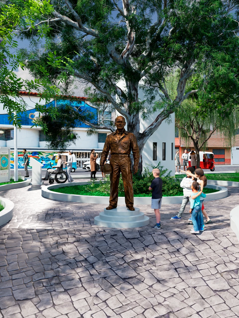 Escultura de un hombre de pie en una plaza circular empedrada, bajo un gran árbol, con niños alrededor.