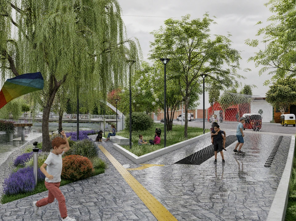 Paseo peatonal con franja podotáctil amarilla, sauces y jardines de lavanda; un niño corre en primer plano.